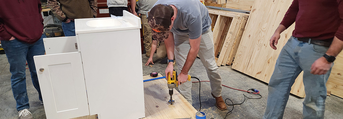 Students assembling cabinet