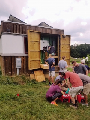 PV2 Class at E3 House Replacing Batteries