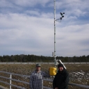 Brent Summerville and Robb O'Brien install a wind measurement system